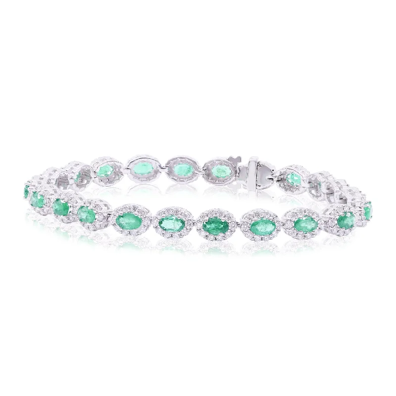 Sleek bangle bracelets with modern metallic finishes for a polished, chic design-14K WHITE GOLD OVAL EMERALD AND DIAMOND HALO BRACELET