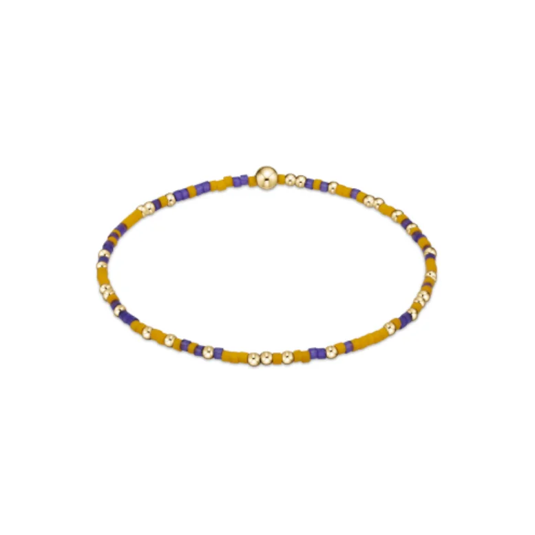 Best bangle bracelets with twisted rope designs for a textured, nautical-inspired look-enewton extends - gameday hope unwritten bracelet - deep purple-golden yellow