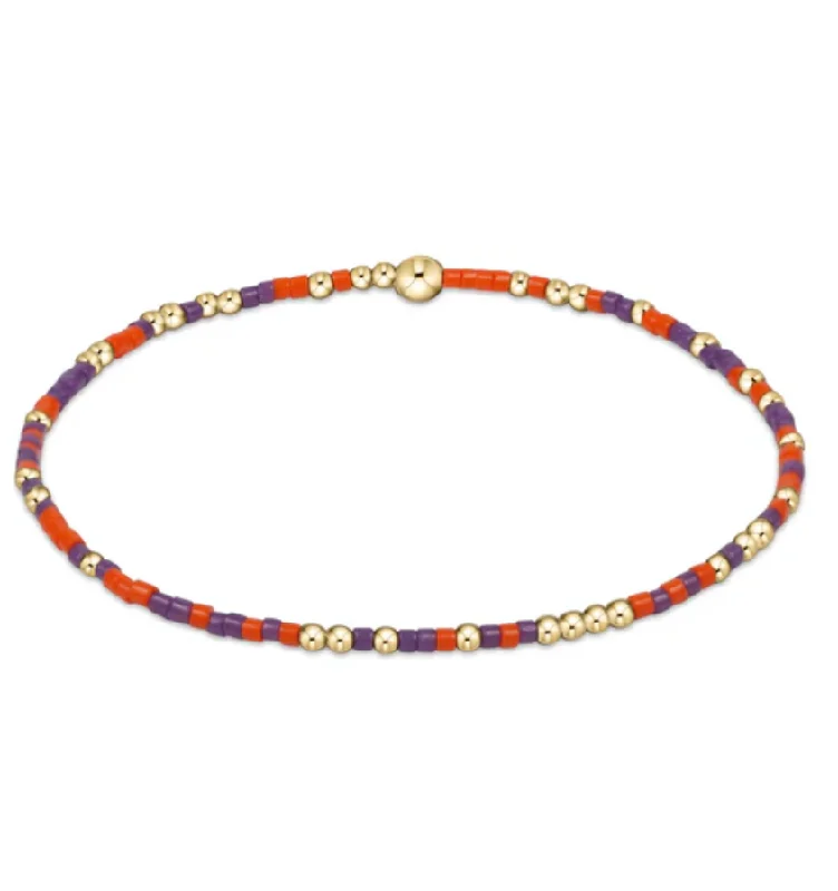 Best bangle bracelets for women with elegant gold designs for every occasion-gameday hope unwritten bracelet -bright orange and purple by enewton