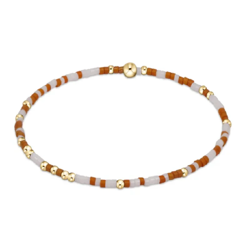 Stylish bangle bracelets with gemstone accents for a chic and modern look-gameday hope unwritten bracelet -burnt orange and white by enewton