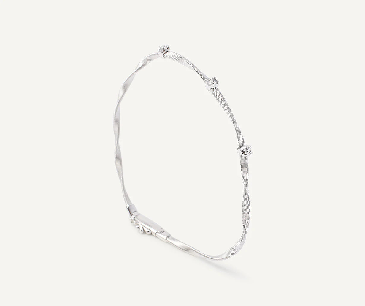 Best bangle bracelets with intricate filigree patterns for an elegant and detailed finish-Marrakech White Gold Twisted Coil Bracelet With Diamonds